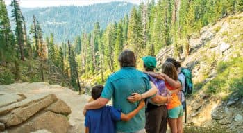 A family hugging on the mountains