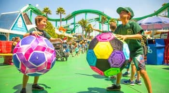 campers playing with large soccerballs on the boardwalk