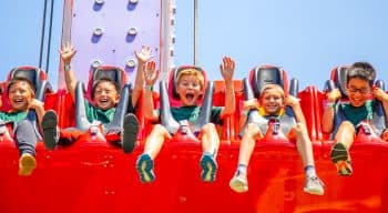 Campers on a boardwalk ride