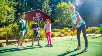 Group of campers golfing at summer camp