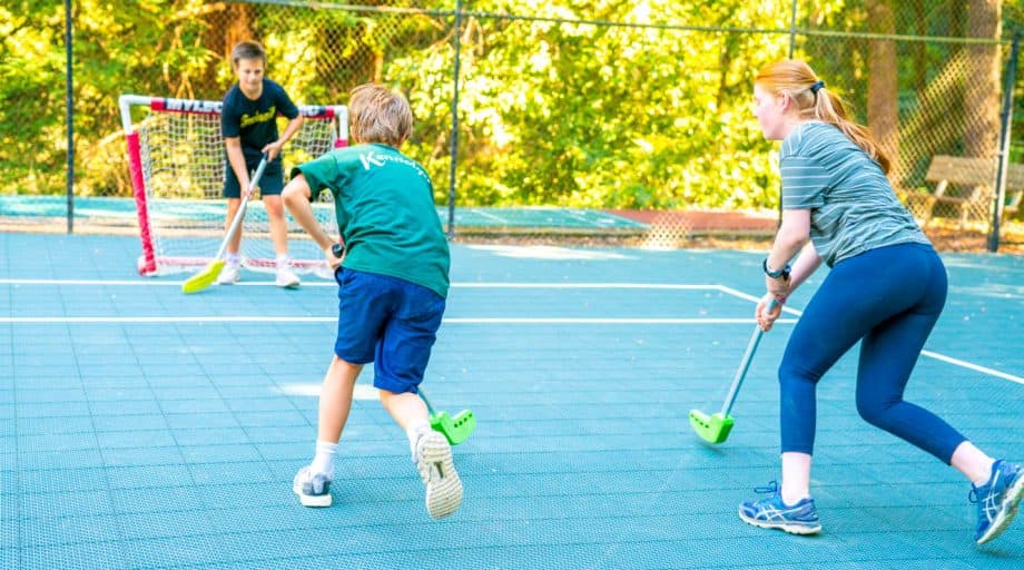 Summer campers play street hockey