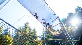 Campers swinging on a trapeze