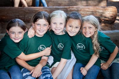 Five campers smiling for a photo 