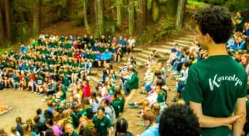 Campers and counselors gathered at the ampetheater campfire