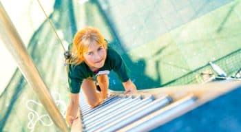 Aerial view of a girl climbing a ladder