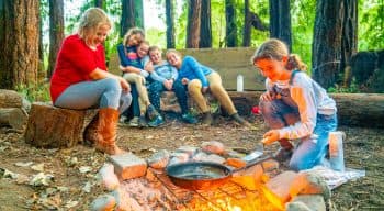 Camping group does outdoor cooking