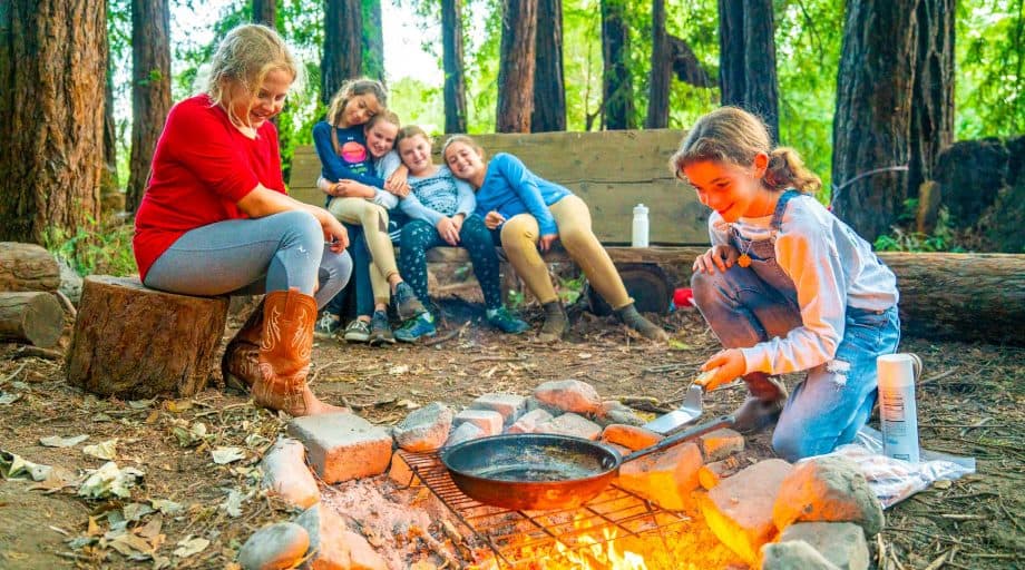 Camping group does outdoor cooking