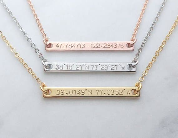 Three necklaces with coordinates on them in different colors