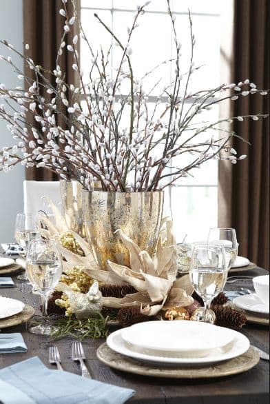 A nice bouquet of pussywillow branches on a table