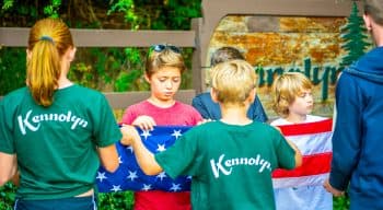 Campers folding the american flag