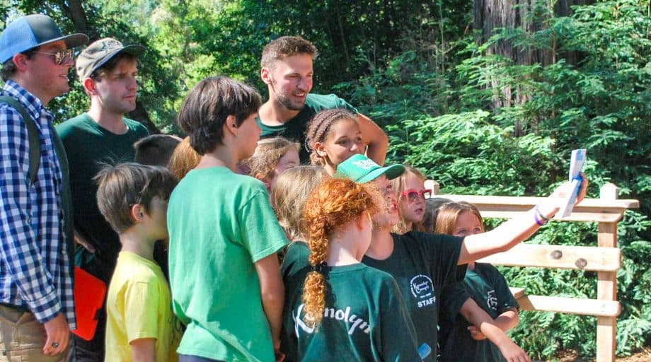 Campers and counselors performing a play