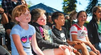 Campers singing together happily