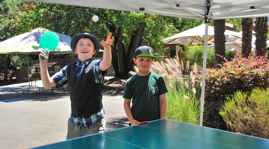 Day campers play ping pong