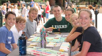 Campers and counselors playing board games