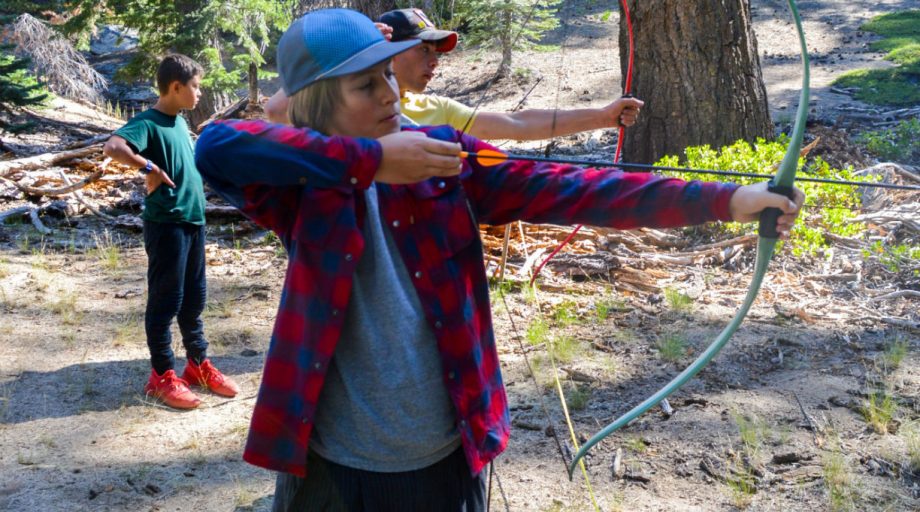 A boy shooting an arrow